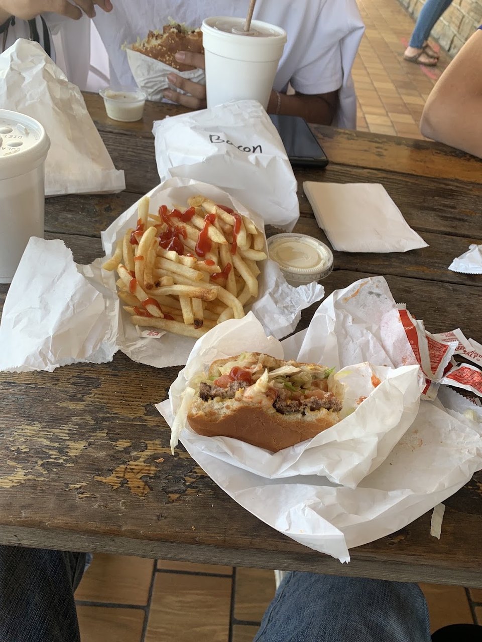 Counter menu with sandwiches, floats, and desserts.
