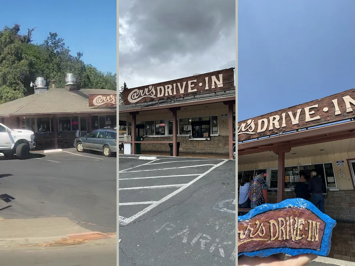 Classic drive-in exterior with parked cars nearby.